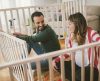 New parents building a cot for their child