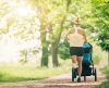 Running woman with baby stroller