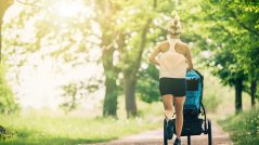 Running woman with baby stroller