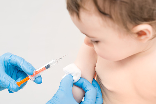 Young child getting vaccination