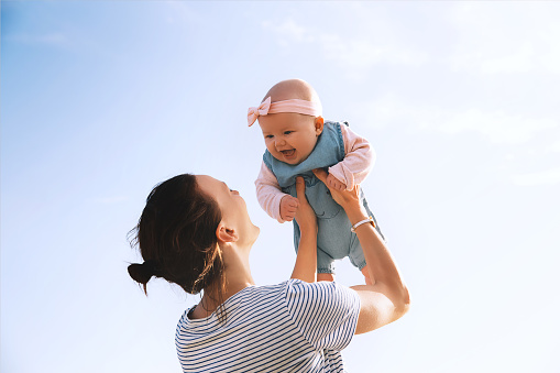 Happy mum and smiling baby girl