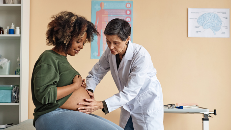 Pregnant lady being seen by doctor