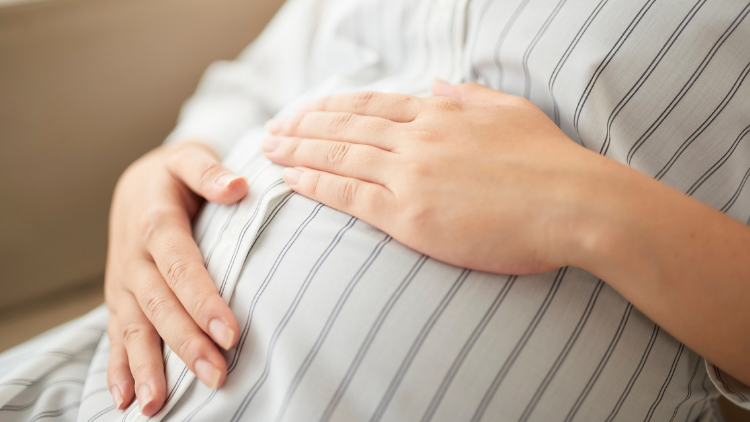 Pregnant lady holding her bump