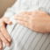 Woman holding tummy